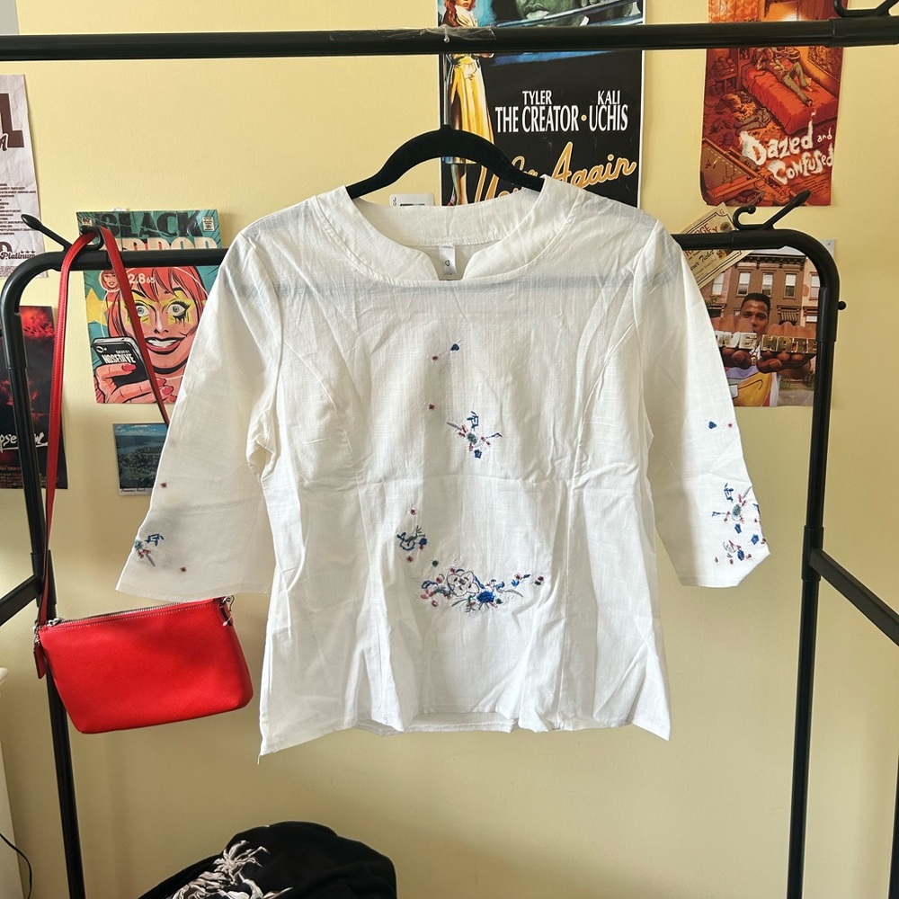 White Blouse with Blue Floral Accents